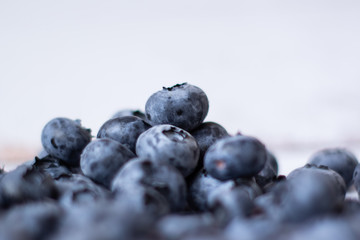 Fresh blueberries on a white background.