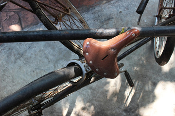 Brown saddle of the ancient bicycle