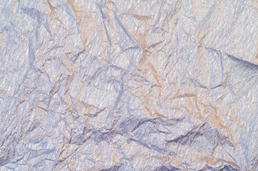 Background of silver and golden crepe tissue paper