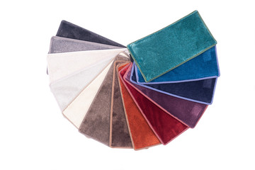 Types and samples of carpets in different colors. Carpets for rooms, apartments and houses