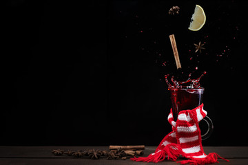 flying in mulled wine spices on dark background, space for text