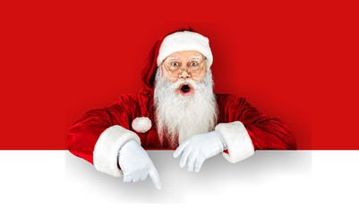 Portrait of santa claus with a poster on background
