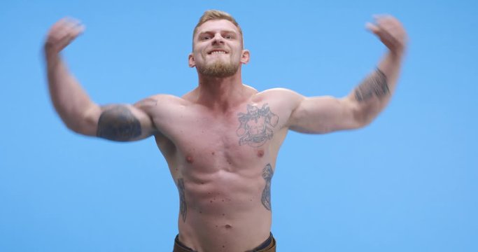 Buff man flexing his arms
