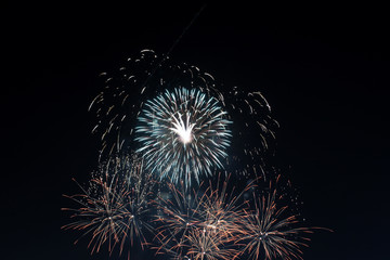 Brightly colorful fireworks in the evening sky background