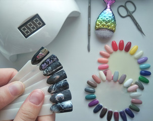Dark gloomy designs on the tips. Color palette. Drawings on manicure tips in black on the...