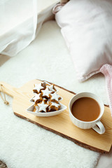 Christmas cookies stars, cocoa on a wooden board.