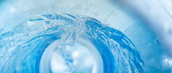Narrow background with a swirl of blue clear water