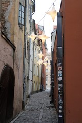 Riga, Latvia, November 2019. The narrowest medieval street of the city.