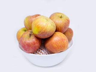 Fototapeta na wymiar red Apple Honey Core in a bowl on white background