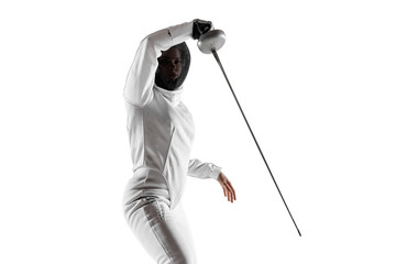 Teen girl in fencing costume with sword in hand isolated on white studio background. Young female caucasian model practicing and training in motion, action. Copyspace. Sport, youth, healthy lifestyle. - obrazy, fototapety, plakaty