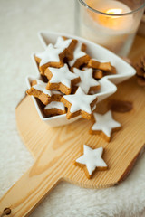 Christmas home decor in pink colors. Mug of hot cocoa, cookies, candle.