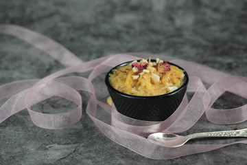 Seviyan or Vermicelli kheer, an Indian dessert made of semolina noodles topped with rose petals and dry fruits such as Cashews