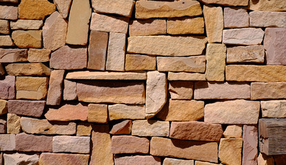Stone walls made of small pieces of stone arranged background