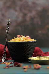 Seviyan or Vermicelli kheer, an Indian dessert made of semolina noodles topped with rose petals and dry fruits such as Cashews