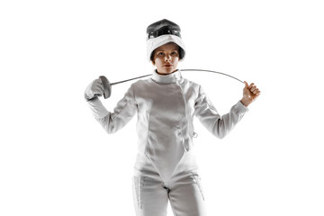 Teen girl in fencing costume with sword in hand isolated on white studio background. Young female caucasian model practicing and training in motion, action. Copyspace. Sport, youth, healthy lifestyle.