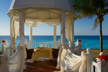 Wedding Chapel with table set for bride and groom at a Varadero Cuba beach resort by the ocean