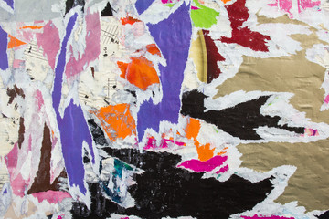 Torn and ripped crumpled pieces of paper posters and placards texture background.