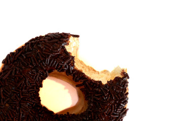 Bitten chocolate donut with colorful sprinkles isolated on white background. Top view.