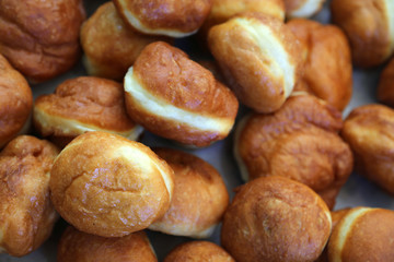 Crusty carnival donuts fried in oil on new years event