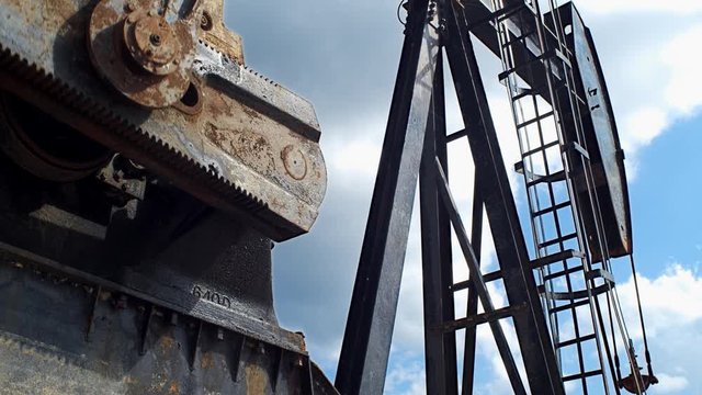 4k Close shot of pumpjack in action in an oil field
