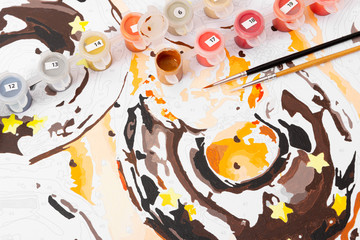 Drawing by numbers with acrylic paints.