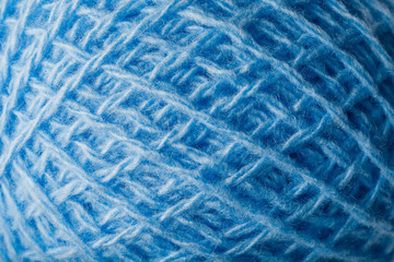 Wool yarn close-up colorful blue threads for needlework.