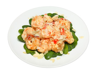 Fototapeta na wymiar Healthy fresh salad with shrimps, spinach and almond nuts shavings