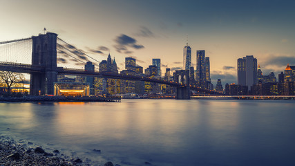 Brooklyn bridge East river and Manhattan after sunset, New York City