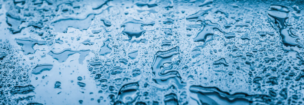 Water texture abstract background, aqua drops on blue glass as science macro element, rainy weather and nature surface art backdrop for environmental brand design