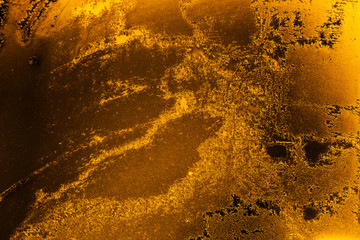 Abstract ice textured background in amber