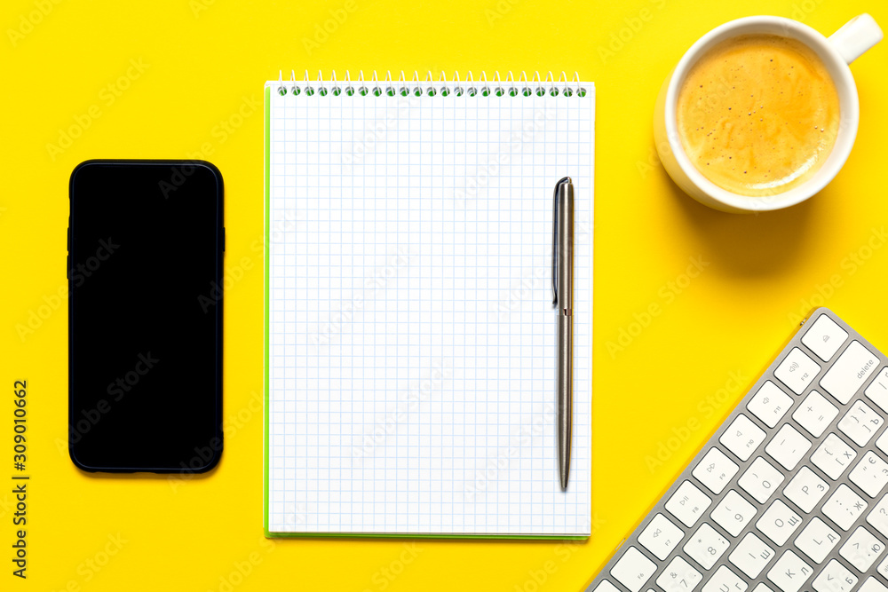 Poster top view of business working place with cup of coffee, empty workspace on yellow table background.