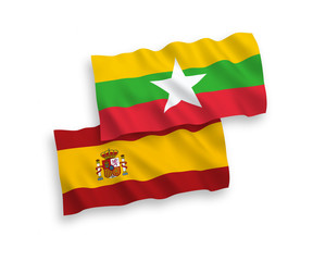Flags of Myanmar and Spain on a white background