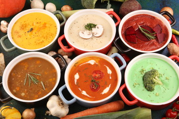 Variety of colorful vegetables cream soups and ingredients for soup. Concept of healthy eating or vegetarian food with mushrooms