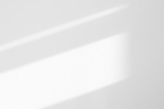 Fototapeta Organic drop diagonal shadow on a white wall. Overlay effect for photo, mock-ups, posters, stationary, wall art, design presentation