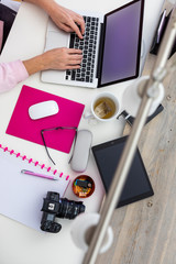 Hands on a computer keyboard from above