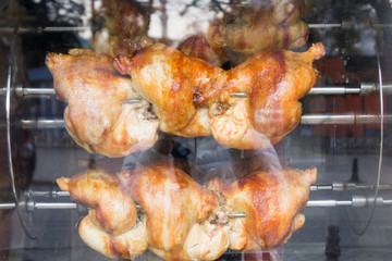 grilled chickens are roasted in the oven on the street