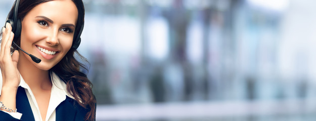 Call Center Service. Support or sales agent. Female caller or receptionist phone operator. Copy space for some text, advertising or slogan. Help line answering and telemarketing. Confident style.