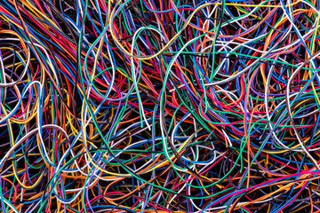 Scrap colorful electrical telecommunication wire close-up, recycling industry