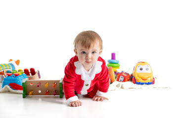 Baby dressed like Santa crawling