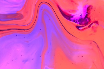 Orange-pink abstract background. Bright colors flow freely and create an interesting structure....