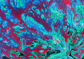 Bright abstract marble purple-red-blue background. Acrylic paint flows freely and creates an...