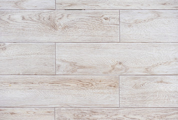 Naklejka premium Beige porcelain tiles with imitation of wooden boards.