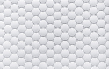 White ceramic tile with volumetric circles. White 3D background.