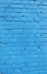 bright blue painted old brick wall