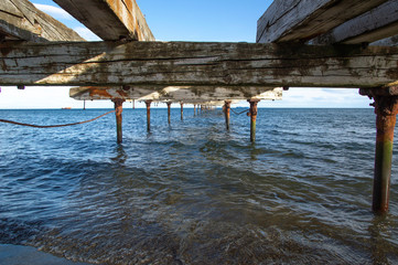 Old and rusty wooden pier in Punta Arenas, Chile
