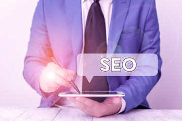 Text sign showing Seo. Business photo text incredibly effective way to market your near business online Businessman pointing with pen in empty copy space