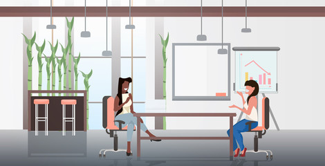 mix race businesswomen sitting at workplace business women discussing new startup project during meeting teamwork concept modern office interior horizontal full length vector illustration