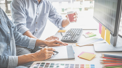 Graphic design and color swatches and pens on a desk. Architectural drawing with work tools and accessories.