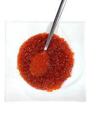 Red caviar in a plate isolate.