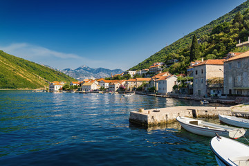 Fototapeta premium Sunny morning view of Kotor bay and coastal road near Tivat, Montenegro.